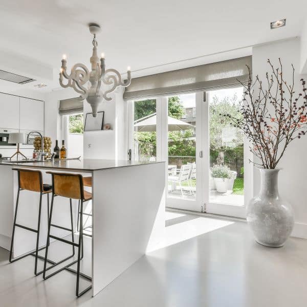 Professional Maid going through our deep house cleaning checklist in beautiful kitchen